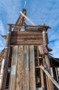 The dilapidated wood frame atop the mineshaft at an abandoned mine in the desert of Nevada, USA Royalty Free Stock Photo