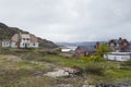 Dilapidated wood houses with peeling paint in Greenland remote ghost mining village