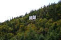 Dildo, a small fishing village in Newfoundland, Town sign on hillside. Royalty Free Stock Photo