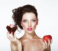 Dilemma. Diet. Undecided Woman with Apple and Cupcake Royalty Free Stock Photo