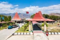 Presidente Nicolau Lobato - Comoro International Airport of Dili, Timor-Leste with national Timorese flag flying. Red roofs.