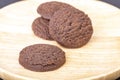 Dilicious chocolate cookies on wooden plate Royalty Free Stock Photo