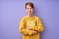 diligent child boy with stack of books for school, back to school. isolated on purple.