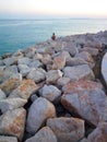 A diligent fisherman catches fish near the open sea on the island of Pag.