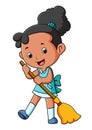 The diligent girl is sweeping the floor with the broom