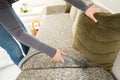 Diligent hand of housewife vacuuming dust Royalty Free Stock Photo