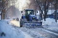 A diligent man braves the winter chill, tirelessly using his tools to clear the snow-covered streets