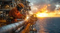 A diligent worker welds metal on an offshore platform during a vibrant sunset