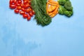 dill. baby tomatoes. carrot. broccoli. on wood blue sky background. space