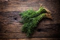 Dill.Bunch of dill on very old rustic oak table