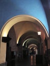 A dim lamp illuminates the ancient arcade Royalty Free Stock Photo