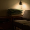 A dim shaded view of sofa with a stack of pillows.