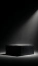 Dim Spotlight Illuminates Rectangular Platform Against Dark Backdrop for Product Launch Event Royalty Free Stock Photo