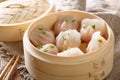 Dim Sum in bamboo steamer, Chinese cuisine. Closeup rustic. horizontal