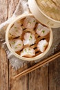 Dim Sum in bamboo steamer, Chinese cuisine. Closeup rustic. Vertical top view Royalty Free Stock Photo