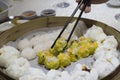 Dim Sum dumplings with steamed buns in the container and chopsticks Royalty Free Stock Photo