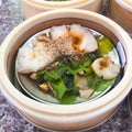 Dim sum , this is a popular Chinese food which were steamed. They are in the small bamboo basket. They are arranged in a small Royalty Free Stock Photo