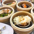 Dim sum , this is a popular Chinese food which were steamed. They are in the small bamboo basket. They are arranged in a small Royalty Free Stock Photo