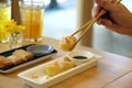 Dim Sum Recipe - Chinese shrimp dumplings topped with fried garlic, served with sour sauce.