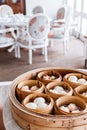 Dim sum set: Barbecued pork bun, Shrimp dumpling, Sweet cream buns, Shrimp shumai topping with goji berry served in steamer basket Royalty Free Stock Photo