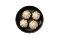 Dim sum stuffed meat dumplings in a pan with herbs. Isolated, white background. Top view. Royalty Free Stock Photo