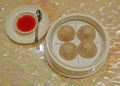 Dim sum xiao long bao or soup dumplings with red vinegar & ginger sauce condiment on the side