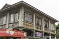 Dimiao, Bohol, Philippines - A two storey building with vernacular Filipino architecture with capiz windows and a wooden Royalty Free Stock Photo