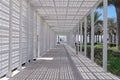 Diminishing futuristic perspective view of entering white trellis passageway to famous Louvre art museum. Abu Dhabi, UAE