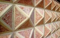 Diminishing perspective of geometric patterned concrete with red stones wall Royalty Free Stock Photo
