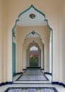 Diminishing perspective interior view of inner Bang O mosque hallway leading into blue wall