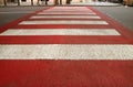 Diminishing Perspective of Red and White Urban Pedestrian Crosswalk