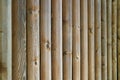 Diminishing perspective of vertical stripe pattern of wooden fence