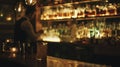 Bartender Making a Drink at a Fancy Bar With Warm Lighting at Night Royalty Free Stock Photo