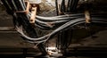 a dimly lit and claustrophobic space showcasing a tangle of old electrical cables suspended from a deteriorating ceiling with visi Royalty Free Stock Photo