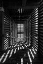 a long hallway with wooden slats leading down into a building Royalty Free Stock Photo