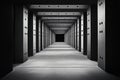 Dimly lit hallway featuring numerous doors leading to a bright light at the end. Royalty Free Stock Photo