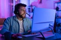 Gamer calmly using computer at night at home Royalty Free Stock Photo