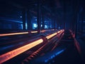 A dimly lit industrial setting within a steel or pipe manufacturing facility, featuring an extended conveyor system and