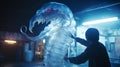 A man is touching an electric blue dinosaur statue in a dark room