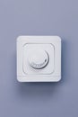 Dimmer Light Switch. A wall switch. Electrician switch. White rolling electricity switch