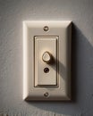 Dimmer Switch on Textured Wall with Knob and Indicator Light, Casting a Shadow Royalty Free Stock Photo