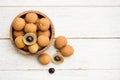 Dimocarpus longan exotic fruits on wooden bowl background - Fresh Longan tropical fruit in Thailand