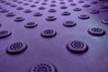 A dimpled background with raised round dots purple Royalty Free Stock Photo