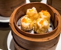 Dimsum Hagao in chinese bamboo basket traditional food in a restaurant.