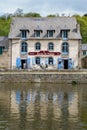 Dinan, Brittany May 7th 2013 : Creperie restaurant in Dinan reflected in the Rance river