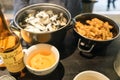 Delicious traditional mussels with roquefort cheese and french fries dish and local apple cider close up view