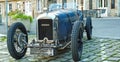 Front of classic french CG Amilcar race cabriolet car from the 30th with crank handle motor starter in village