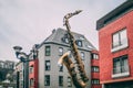 DINANT, BELGIUM - Feb 19, 2014: Saxophone statue on the bridge village