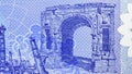 1 Dinar polymer banknote, Bank of Libya, closeup bill fragment shows antique Arch of Marcus Aurelius Royalty Free Stock Photo