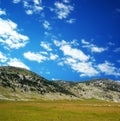 Dinara mountain over blue clouds 4 Royalty Free Stock Photo